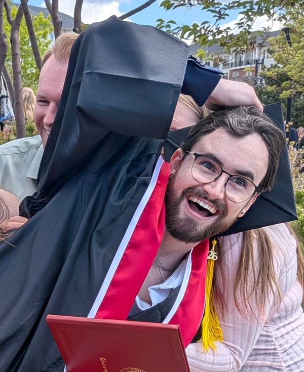 Tanner Sims smiling at graduation